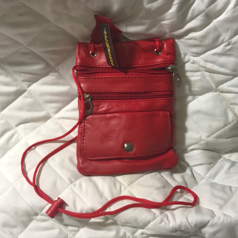 Small hand bag. Multi pocket zippers and snap